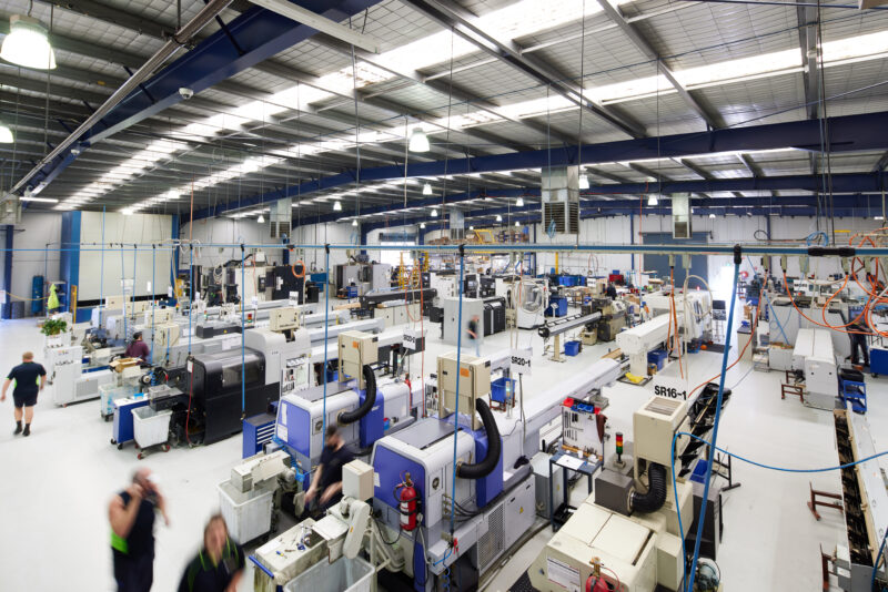 CNC machines in a manufacturing workshop; illustrative image